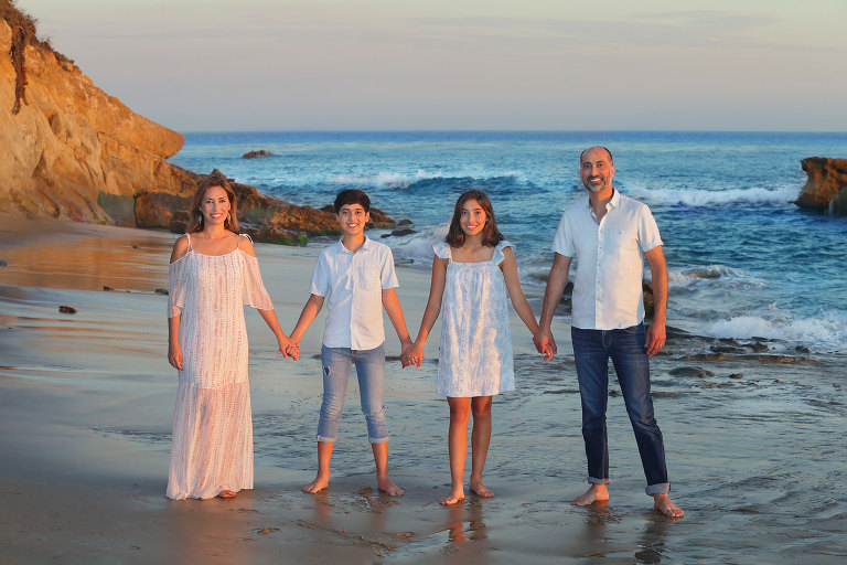 Reflections of family on beach